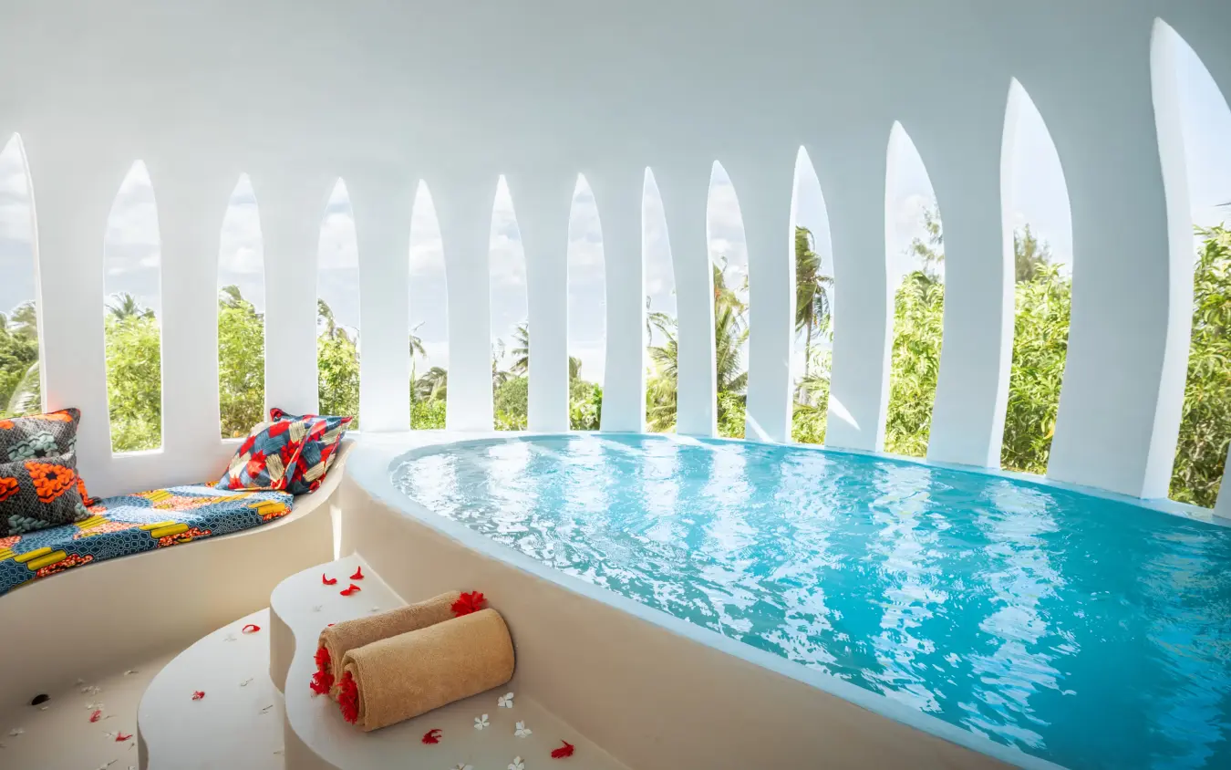Luxury villa pool with white picket fence and garden views, Xanadu Villas, Zanzibar & Pemba, Tanzania