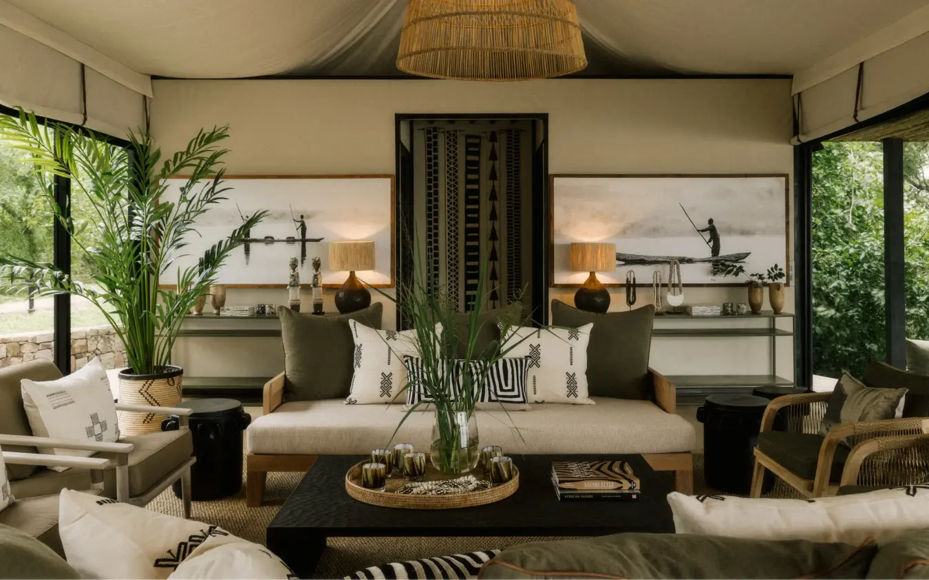 Luxury safari lodge interior with open-air living space and savanna views, Zambezi Sands, Victoria Falls, Zimbabwe