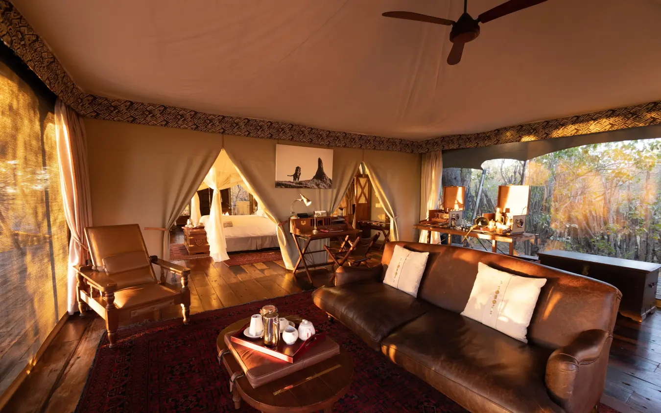 Luxury safari tent interior with leather furnishings and views, Zarafa Camp, Selinda Reserve, Botswana