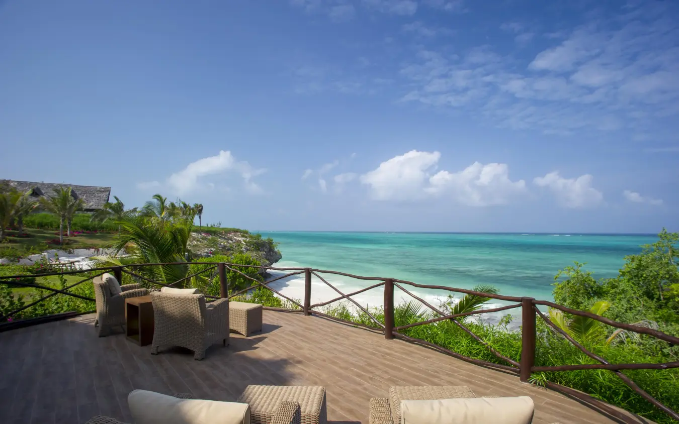 Oceanfront wooden deck with seating overlooking turquoise water, Zawadi Hotel, Zanzibar & Pemba, Tanzania