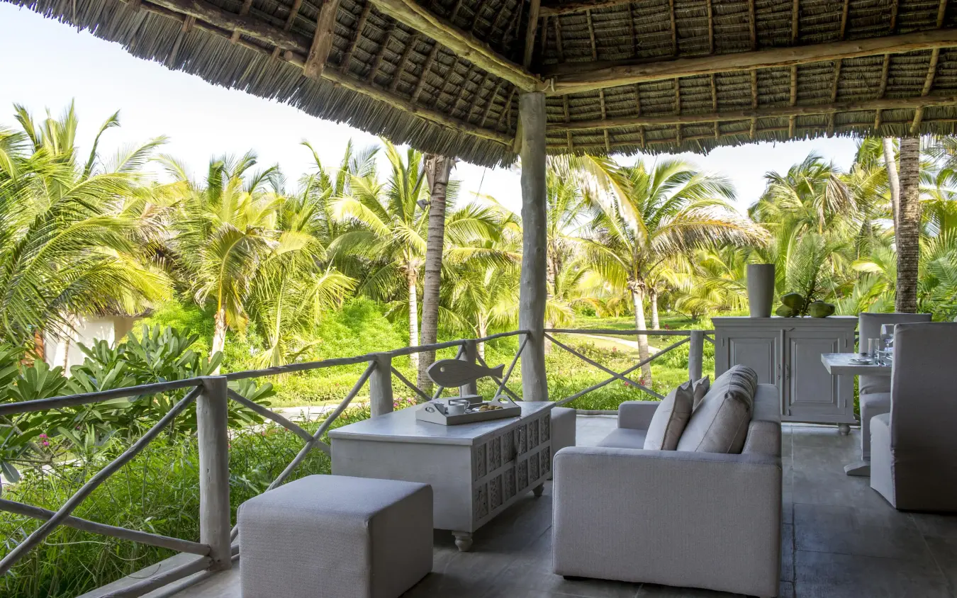 Shaded deck overlooking tropical palm gardens and landscape, Zawadi Hotel, Zanzibar & Pemba, Tanzania