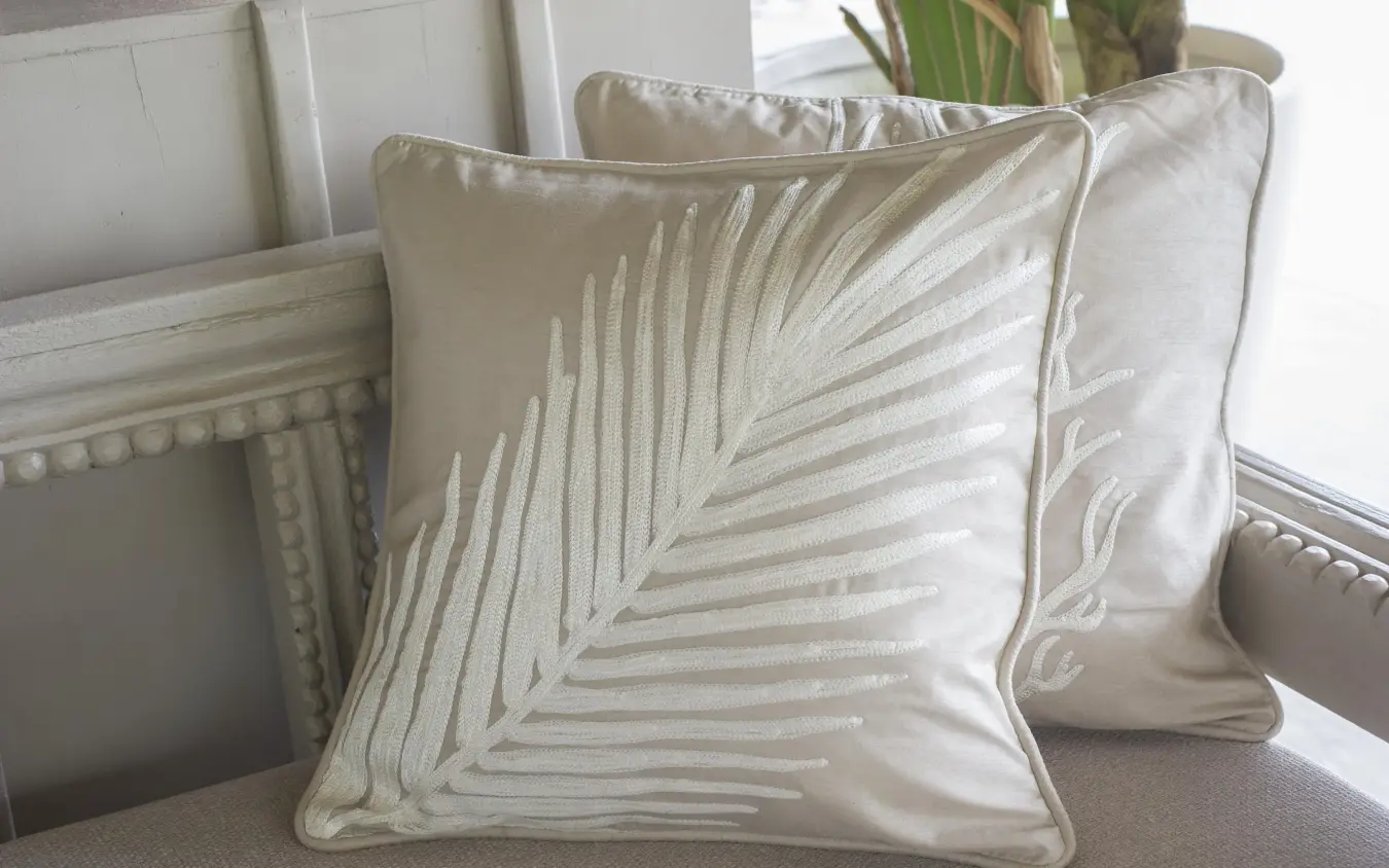 Decorative pillow with palm leaf embroidery on chair, Zawadi Hotel, Zanzibar & Pemba, Tanzania