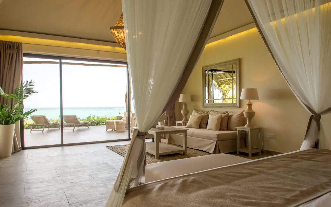 Beachfront bedroom with four-poster bed and ocean view, Zawadi Hotel, Zanzibar & Pemba, Tanzania