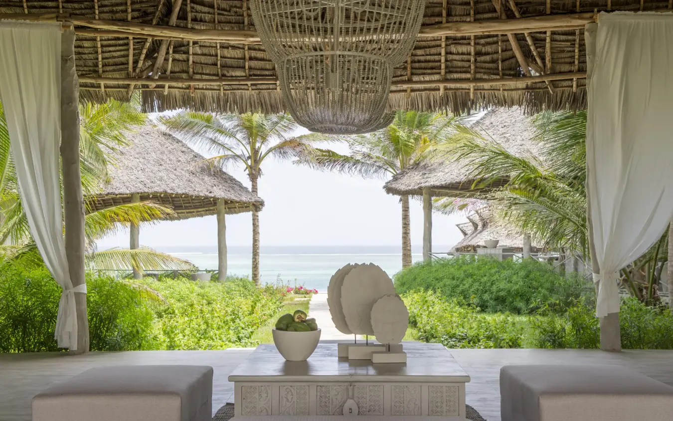 Beachfront lounge with ocean view through palm trees, Zawadi Hotel, Zanzibar & Pemba, Tanzania