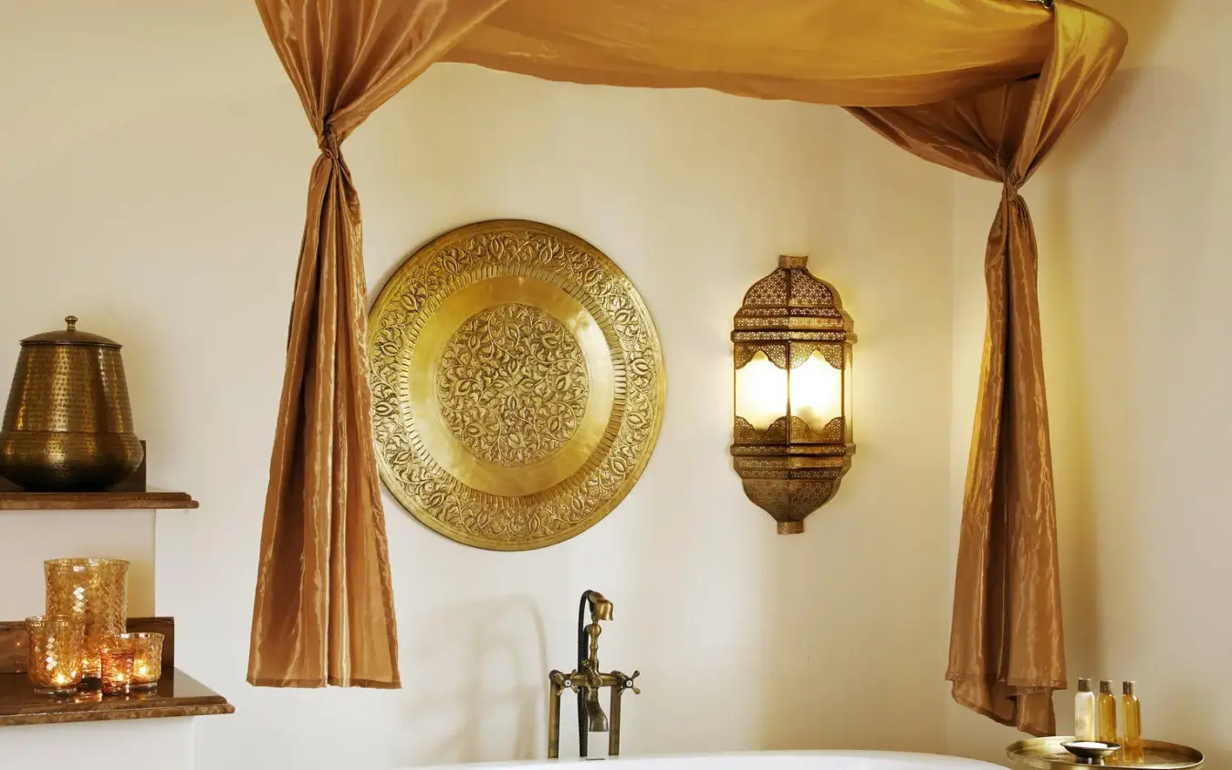 Luxury bathroom with ornate brass fixtures and gold accents, Baraza Resort and Spa, Zanzibar & Pemba, Tanzania