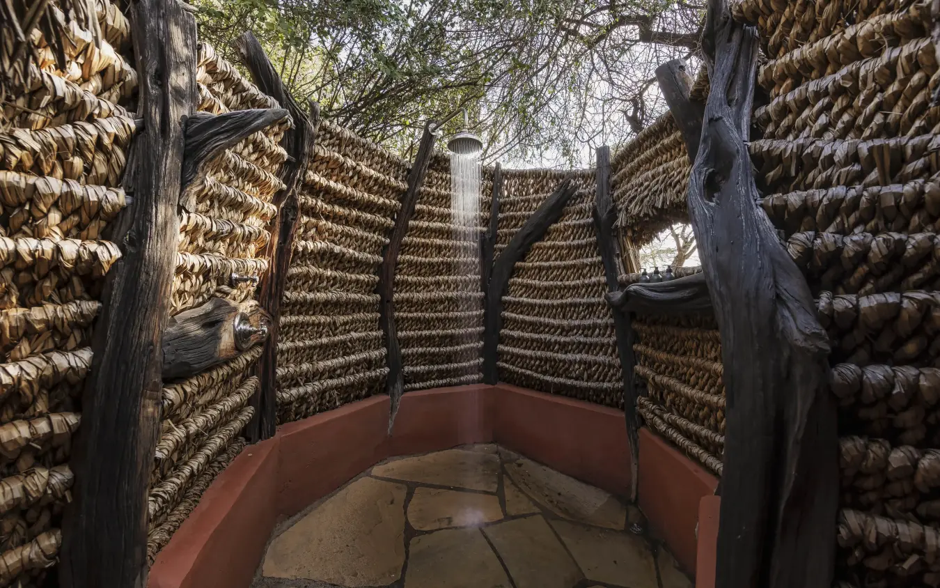 Corn drying racks in traditional agricultural storage structure, Kifaru House, Laikipia Highlands, Kenya
