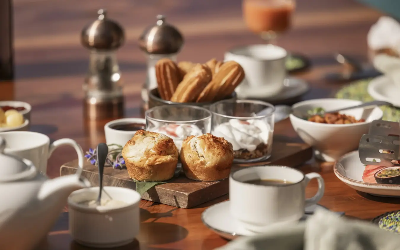 Luxury breakfast table setting with pastries and coffee service, Kifaru House, Laikipia Highlands, Kenya