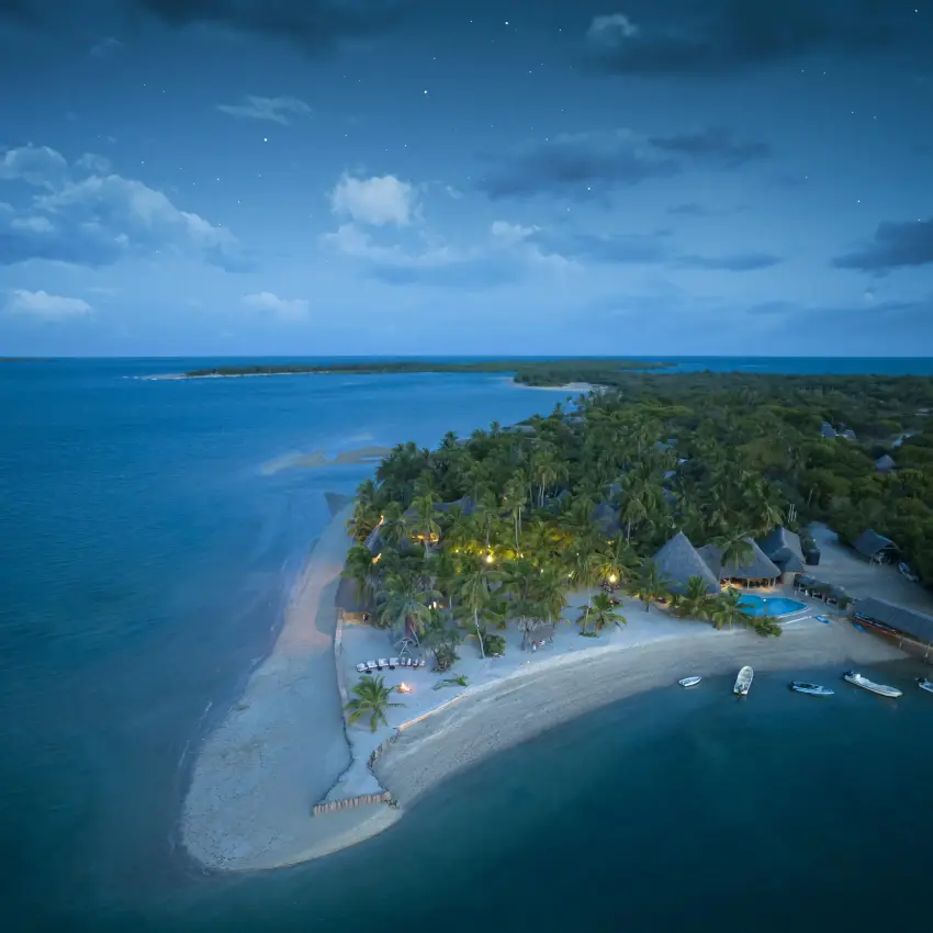 Aerial view of beachfront lodge surrounded by turquoise waters, Manda Bay, Lamu Archipelago, Kenya