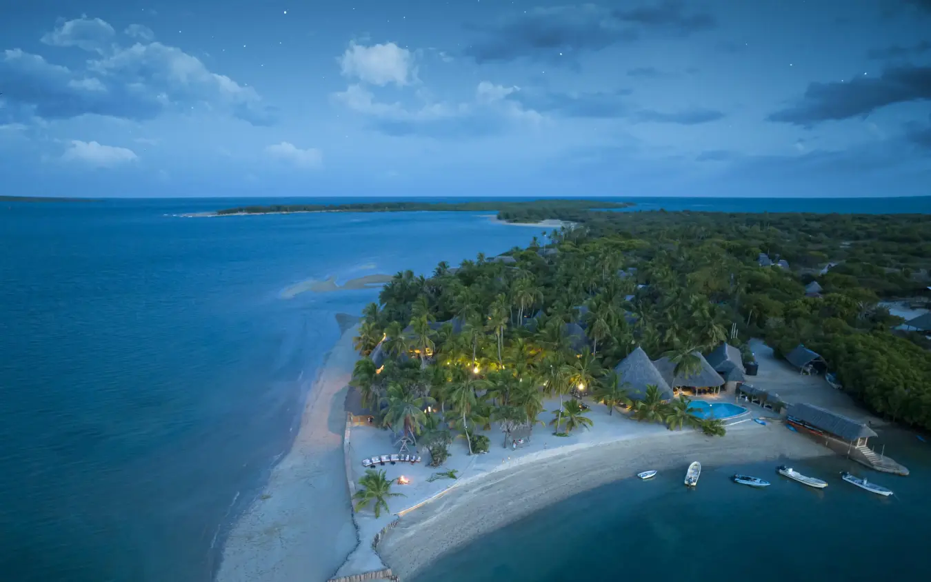 Aerial view of beachfront lodge surrounded by turquoise waters, Manda Bay, Lamu Archipelago, Kenya