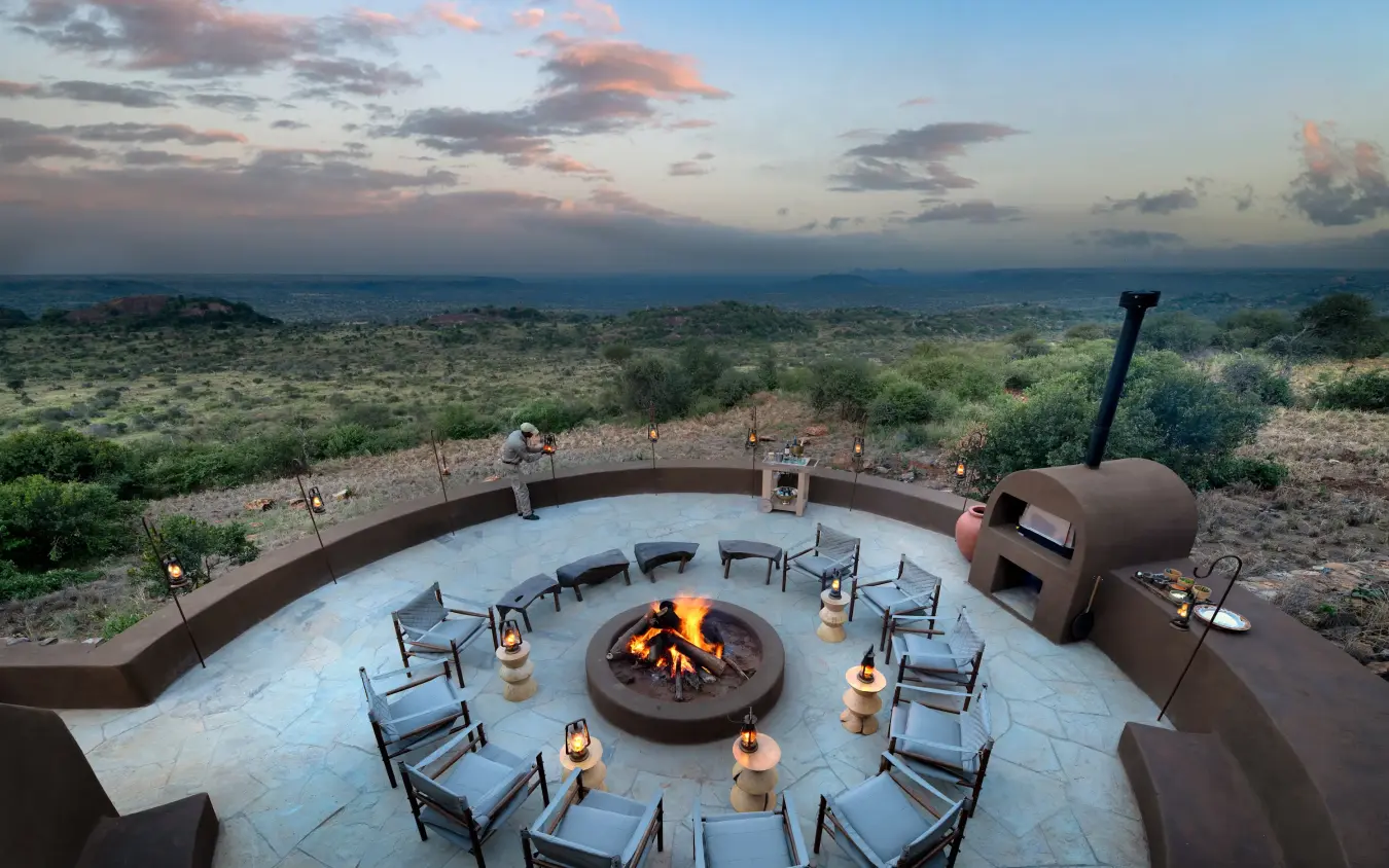 Circular firepit lounge with savanna views at dusk, Suyian Lodge, Laikipia Highlands, Kenya