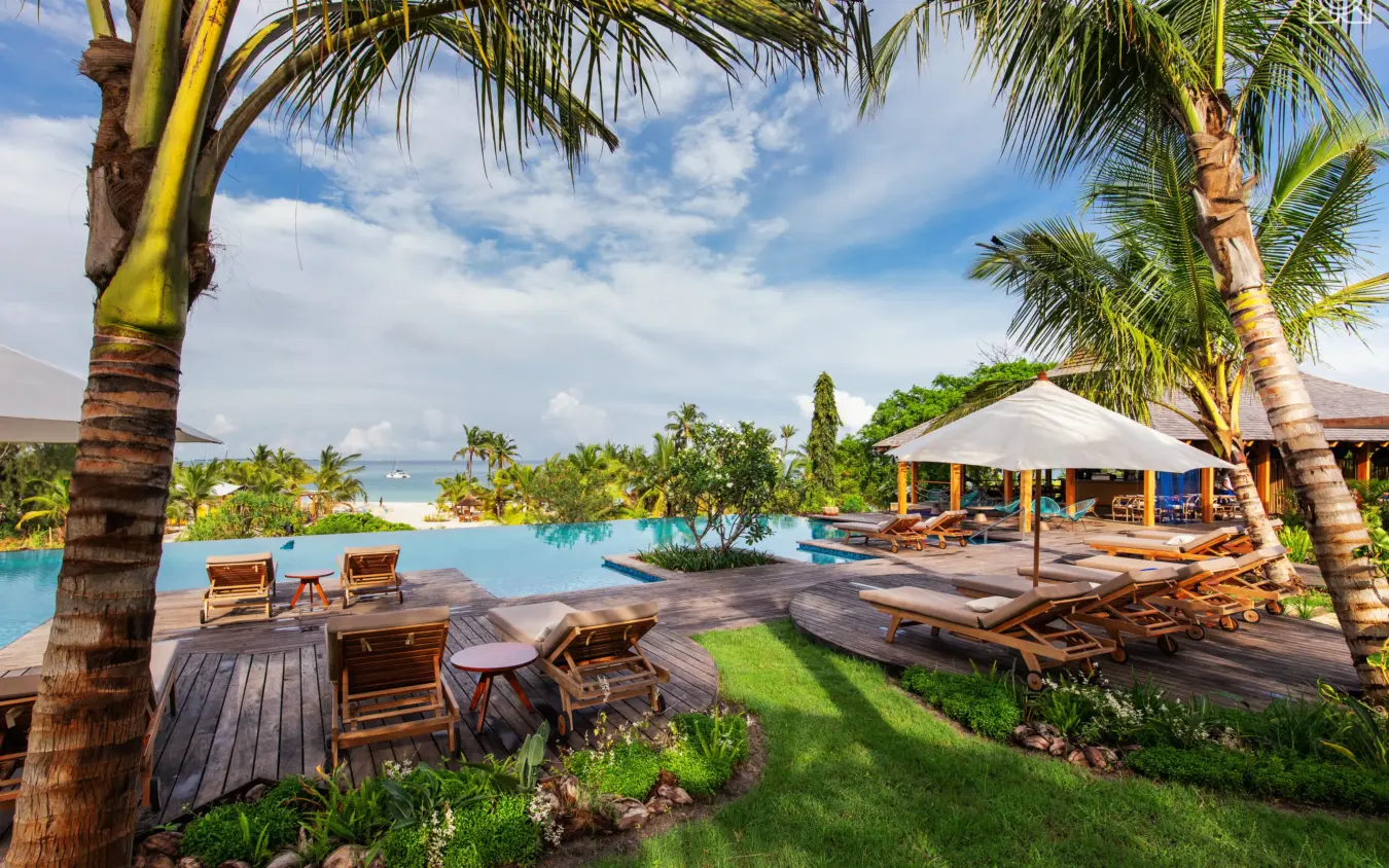 Oceanfront deck with lounge chairs and infinity pool, Zuri Zanzibar, Zanzibar & Pemba, Tanzania