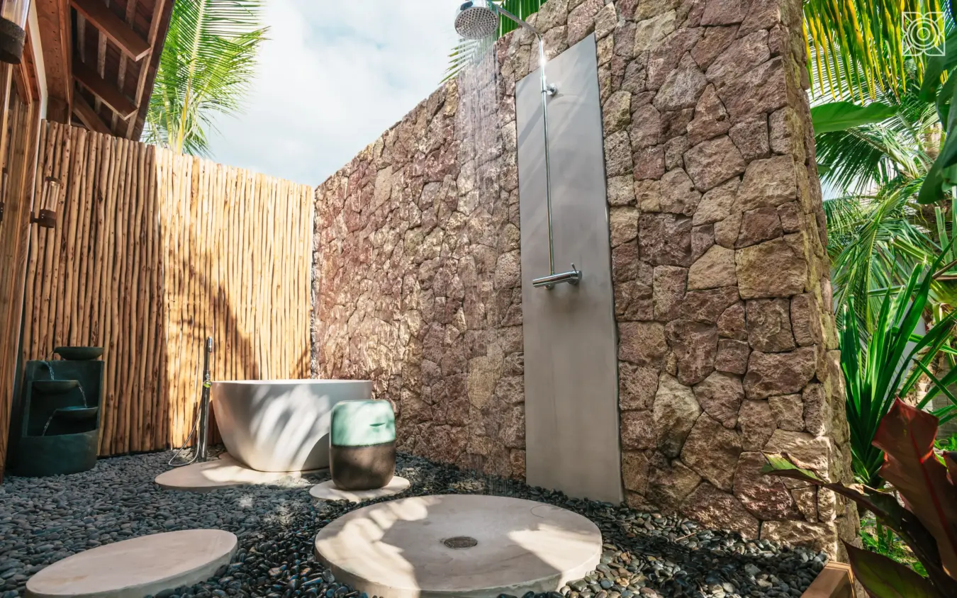 Outdoor shower enclosure with stone walls and tropical plants, Zuri Zanzibar, Zanzibar & Pemba, Tanzania