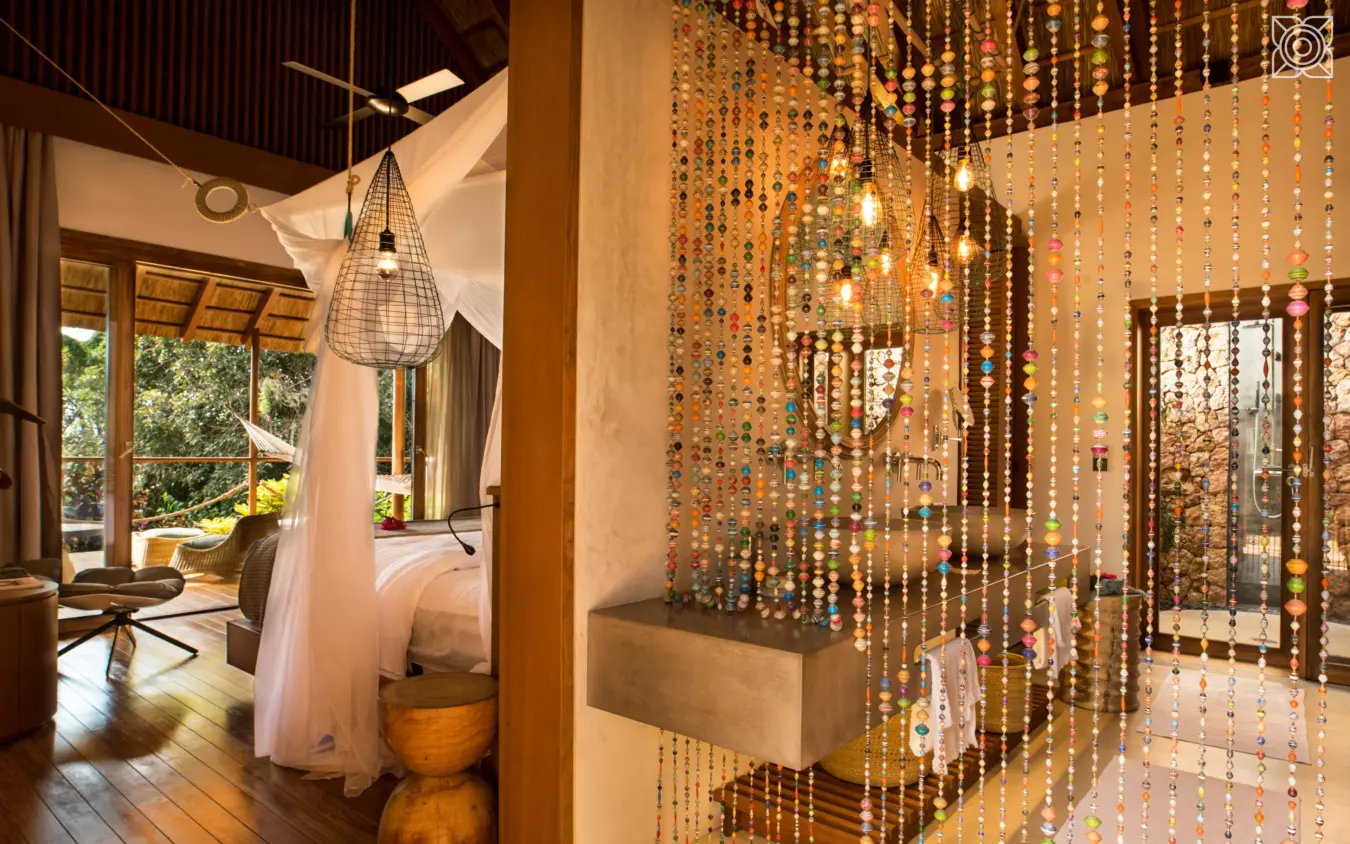 Luxury bungalow interior with beaded curtain room divider, Zuri Zanzibar, Zanzibar & Pemba, Tanzania