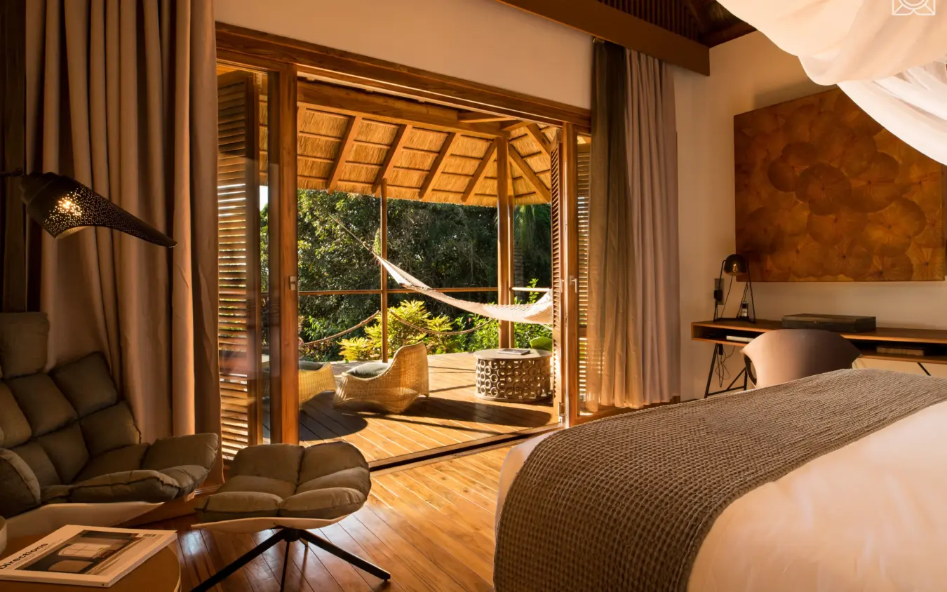 Bedroom with open deck overlooking tropical vegetation and ocean, Zuri Zanzibar, Zanzibar & Pemba, Tanzania