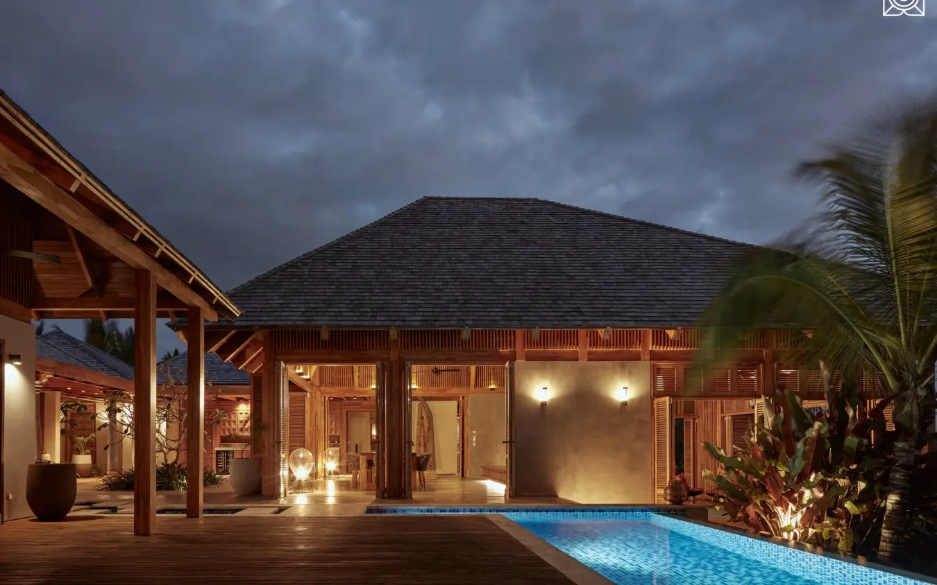 Illuminated villa with pool at dusk under stormy sky, Zuri Zanzibar, Zanzibar & Pemba, Tanzania