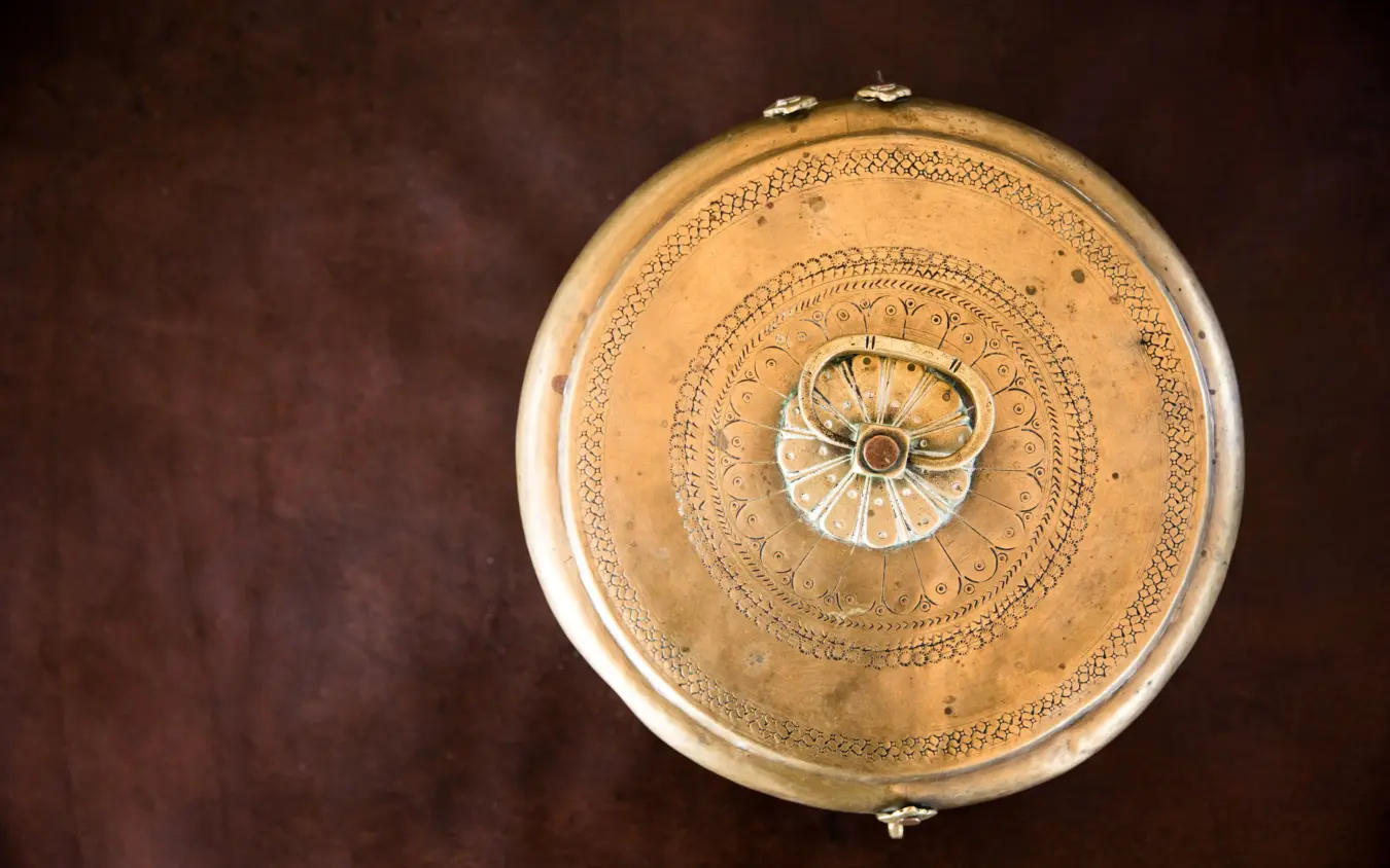 Ornate brass ceiling medallion with decorative geometric patterns, Duba Explorers Camp, The Okavango Delta, Botswana