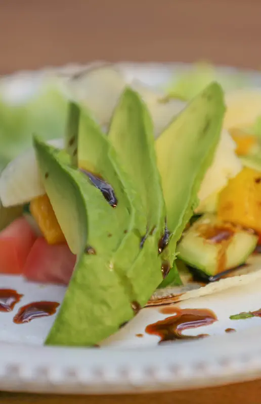 Plated appetizer with avocado, grilled vegetables, and sauce, Karen Gables, Nairobi, Kenya