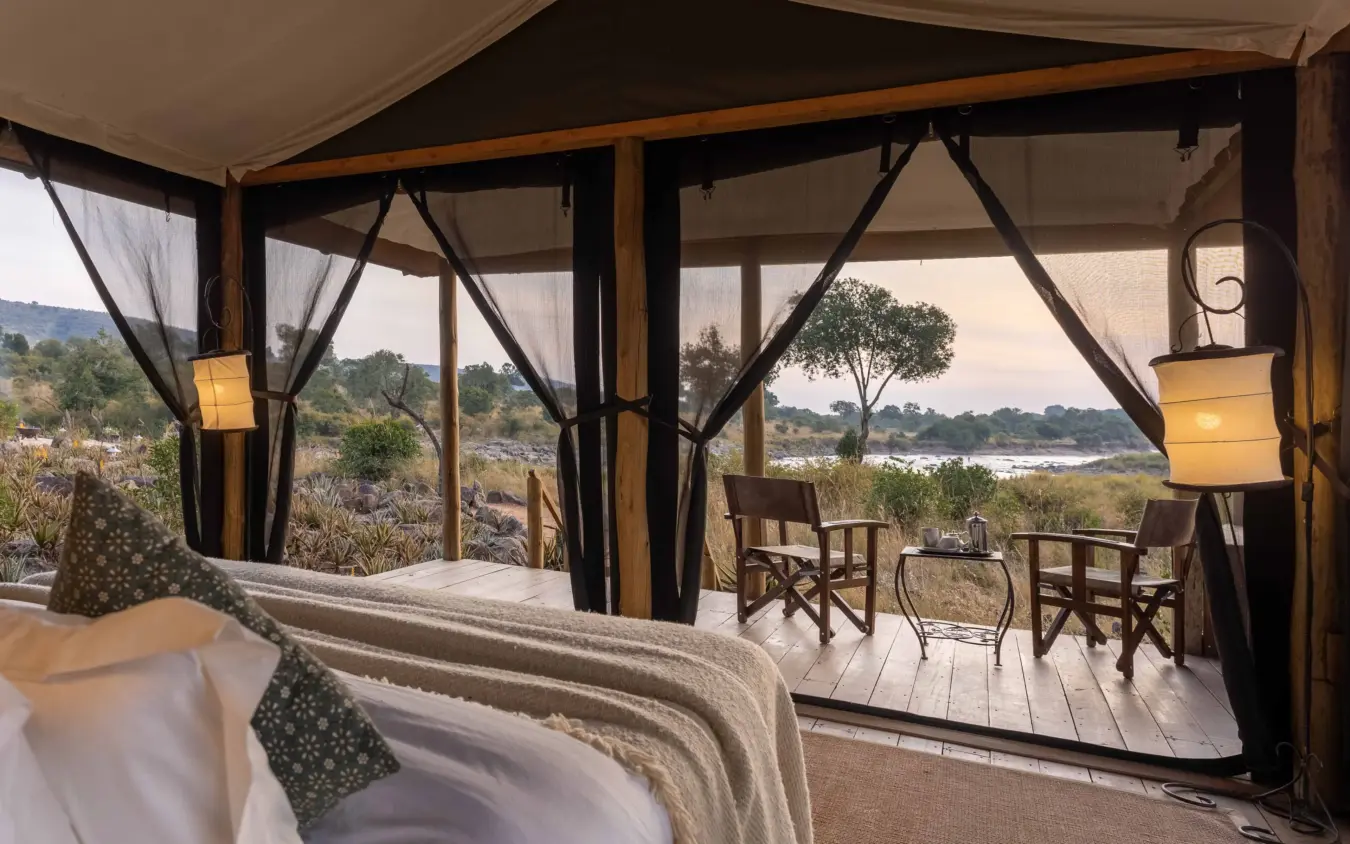 Luxury tent interior with river valley view and outdoor seating area, Kimya Kimya Camp, Maasai Mara, Kenya