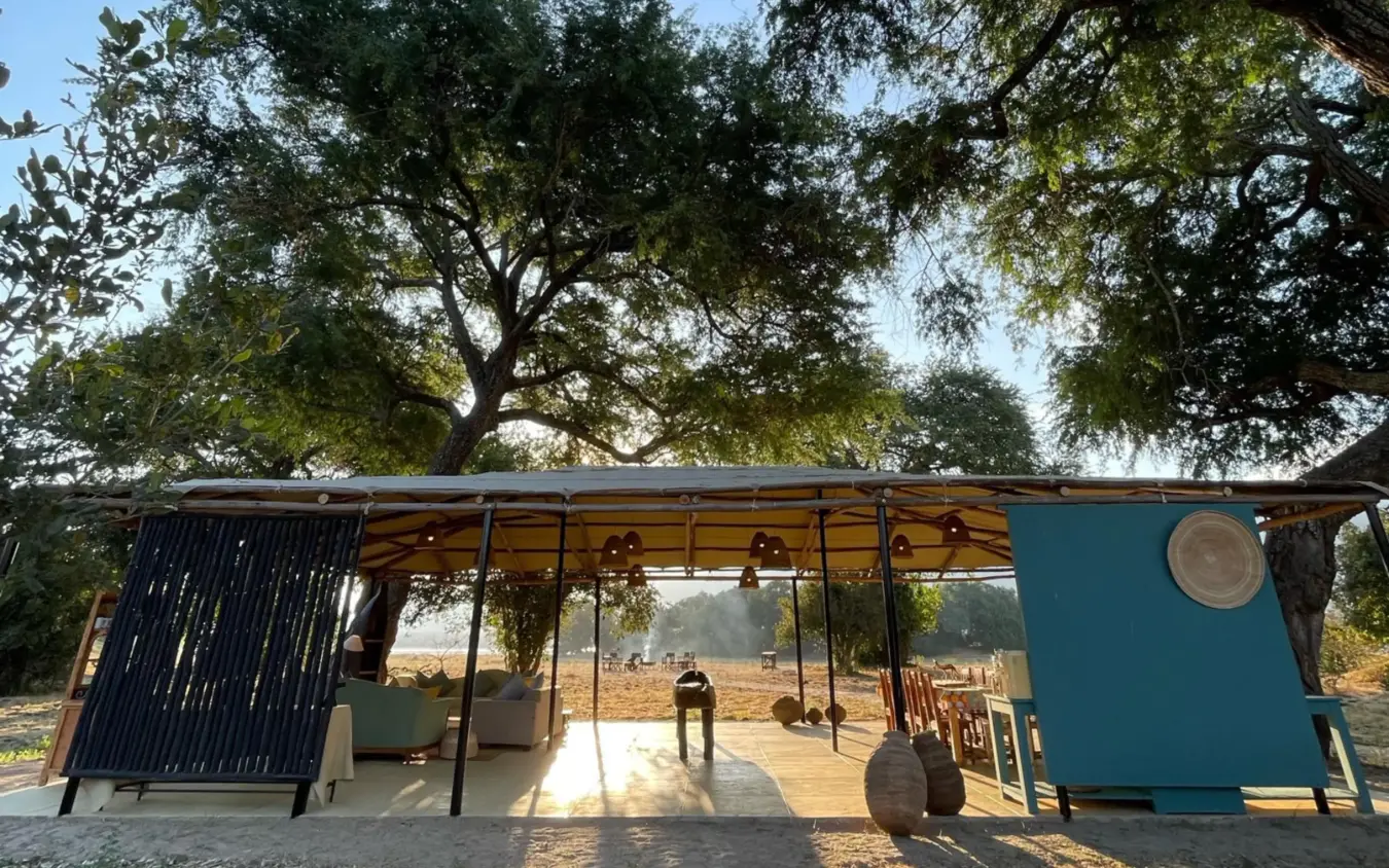 Modern pavilion structure beneath large shade trees, Little Vundu, Mana Pools, Zimbabwe