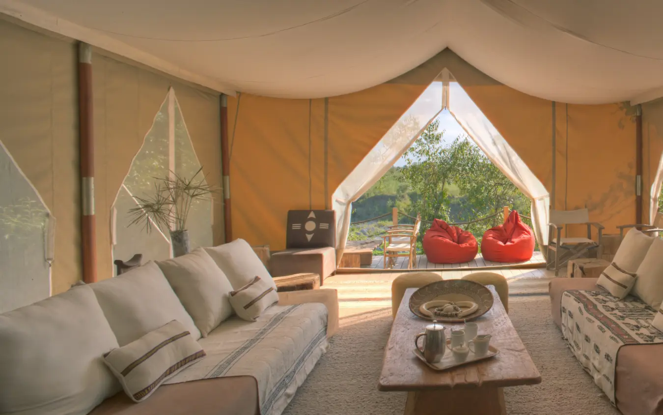 Spacious tent interior with seating areas and scenic views, Naibor Camp, Maasai Mara, Kenya
