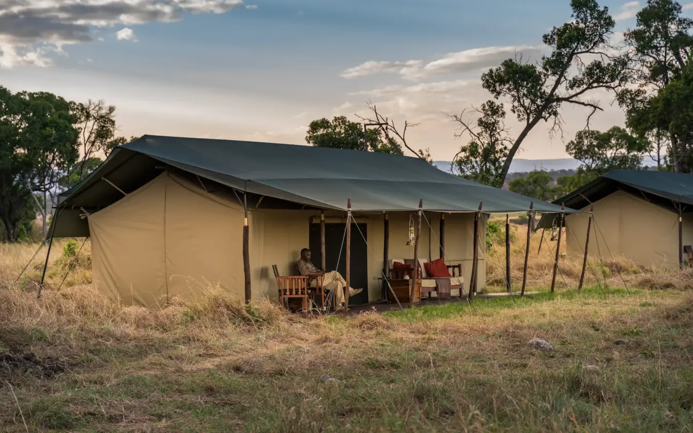 Canvas safari tent with seating area in open grassland savanna, Ndutu Mobile Tented Camp, Serengeti National Park, Tanzania