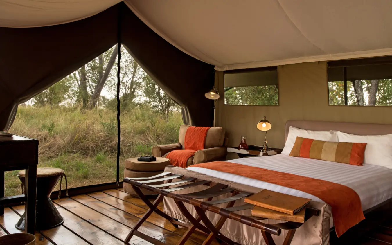 Luxury safari tent bedroom with canvas walls and savanna views, Ndutu Mobile Tented Camp, Serengeti National Park, Tanzania