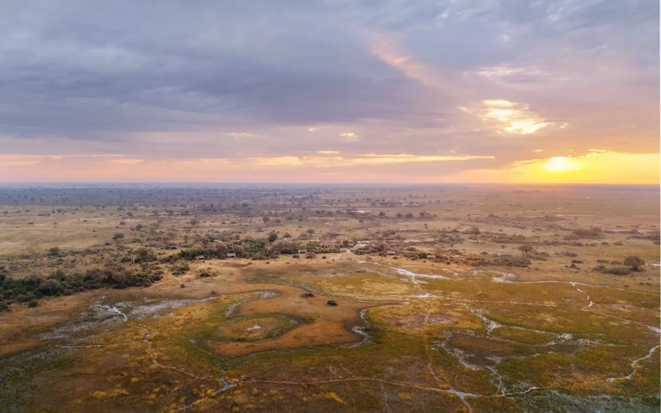 Aerial view of wetland channels and grassland at sunset, Nkasa Linyanti, Zambezi Region, Namibia