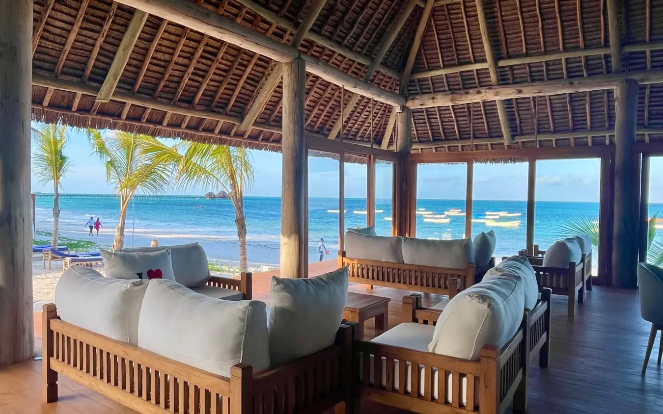 Beachfront lounge pavilion with ocean views and palm trees, Ocean Boutique Hotel, Zanzibar & Pemba, Tanzania