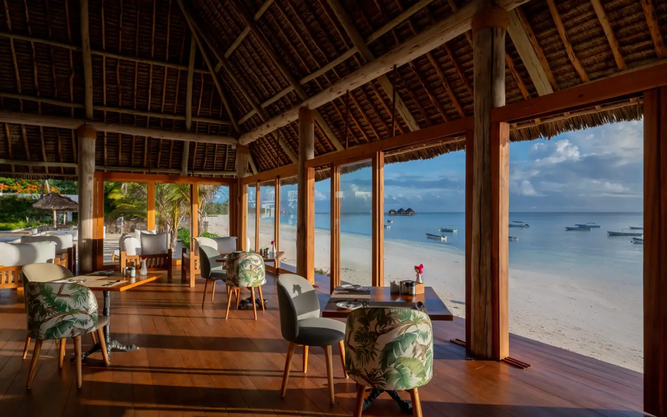 Beachfront lounge pavilion with wooden deck overlooking tropical bay, Ocean Boutique Hotel, Zanzibar & Pemba, Tanzania