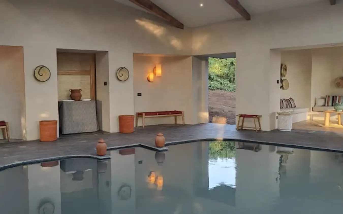 Spa pool with terracotta accents in minimalist wellness pavilion, Osonjoi Lodge, Ngorongoro Crater, Tanzania