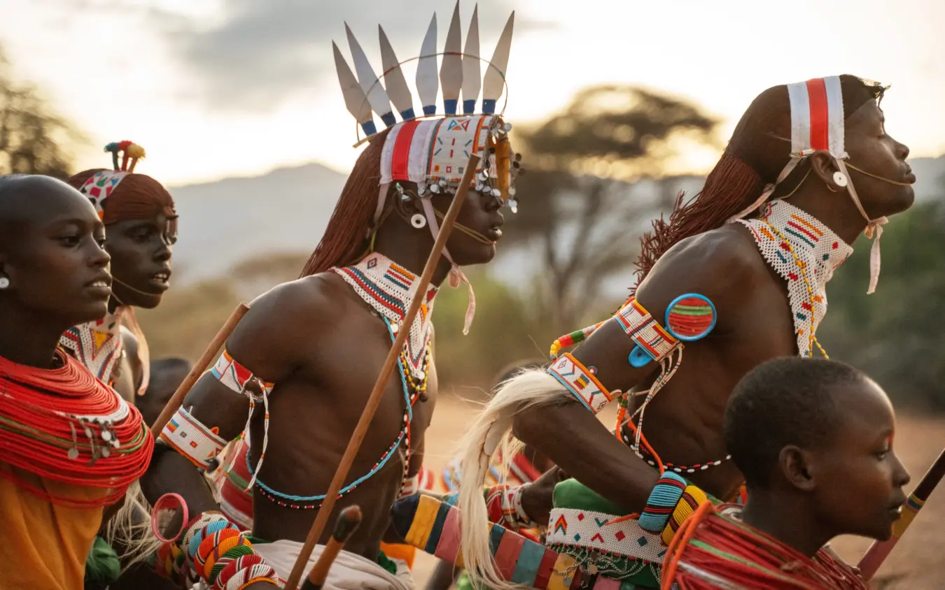 Maasai warriors in traditional beaded regalia and headdresses at cultural gathering, Reteti House, Northern Kenya, Kenya