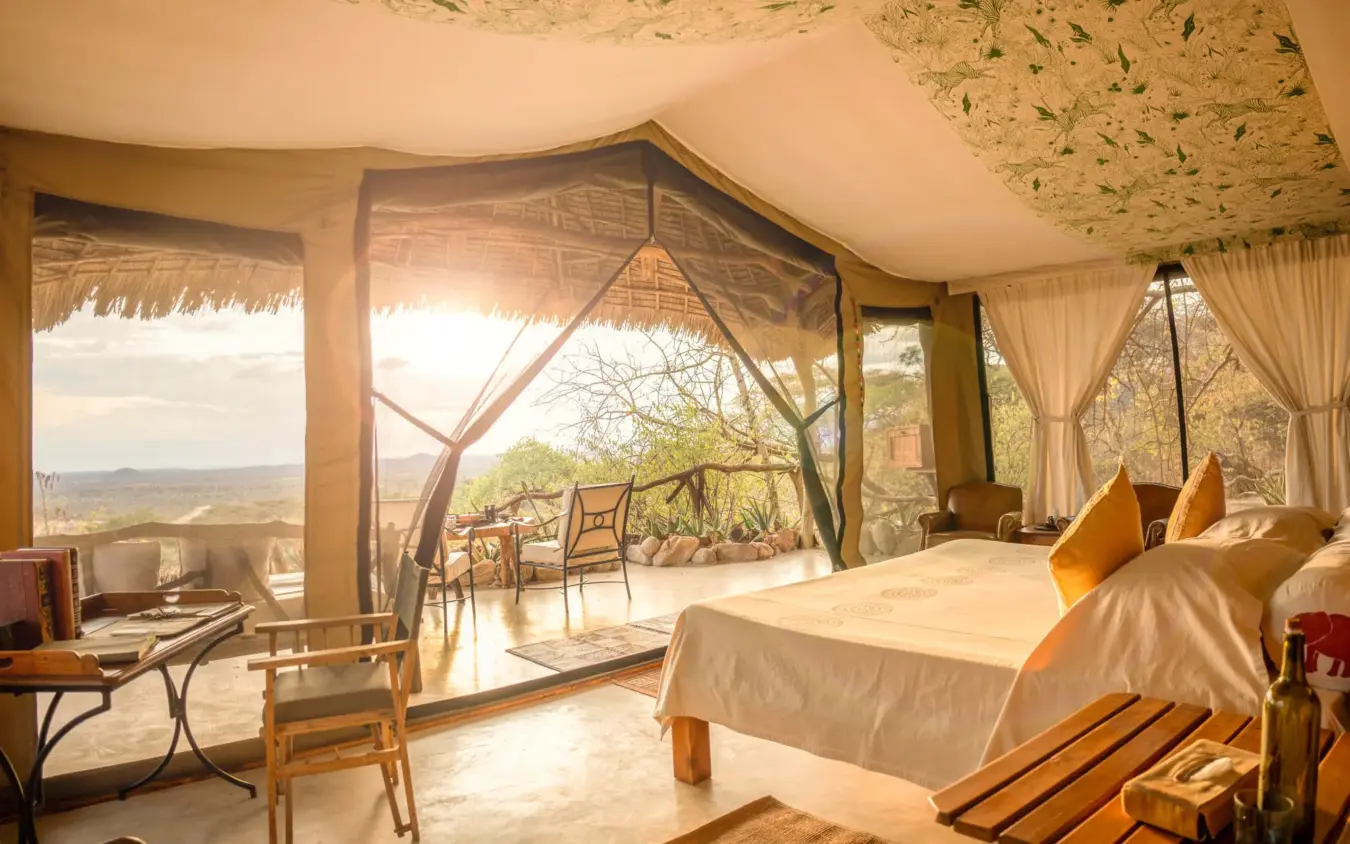 Luxury safari tent bedroom with panoramic views of savanna landscape, Sarara Camp, Northern Kenya, Kenya