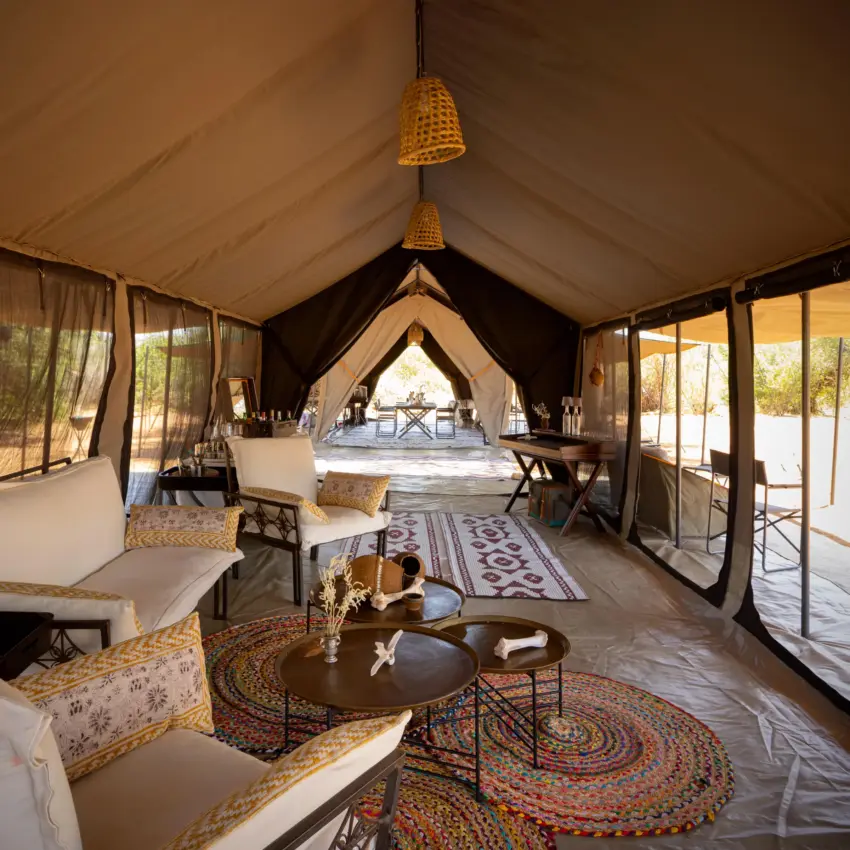 Luxury canvas safari tent interior with lounge area and bedroom suite, Sarara Wilderness, Northern Kenya, Kenya