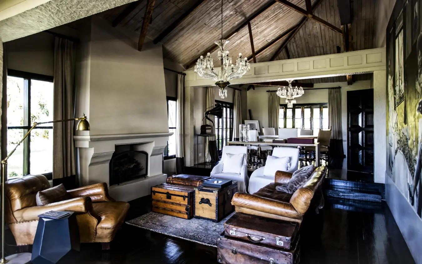 Luxurious interior lounge with leather seating and fireplace, Segera, Laikipia Highlands, Kenya