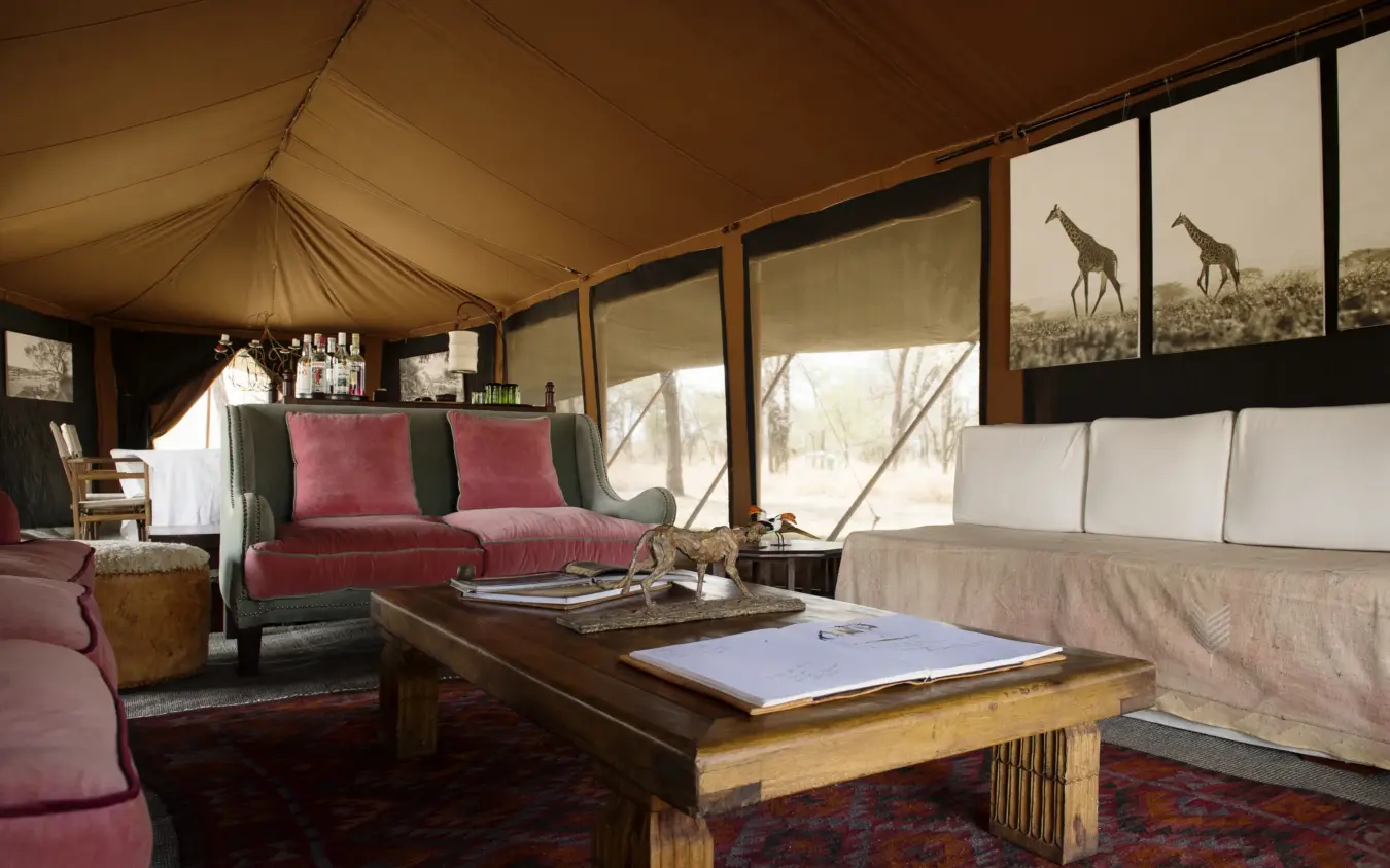 Luxury safari tent interior with canvas walls and floor-to-ceiling windows overlooking savanna, Serian Serengeti Mobile Kusini, Serengeti National Park, Tanzania