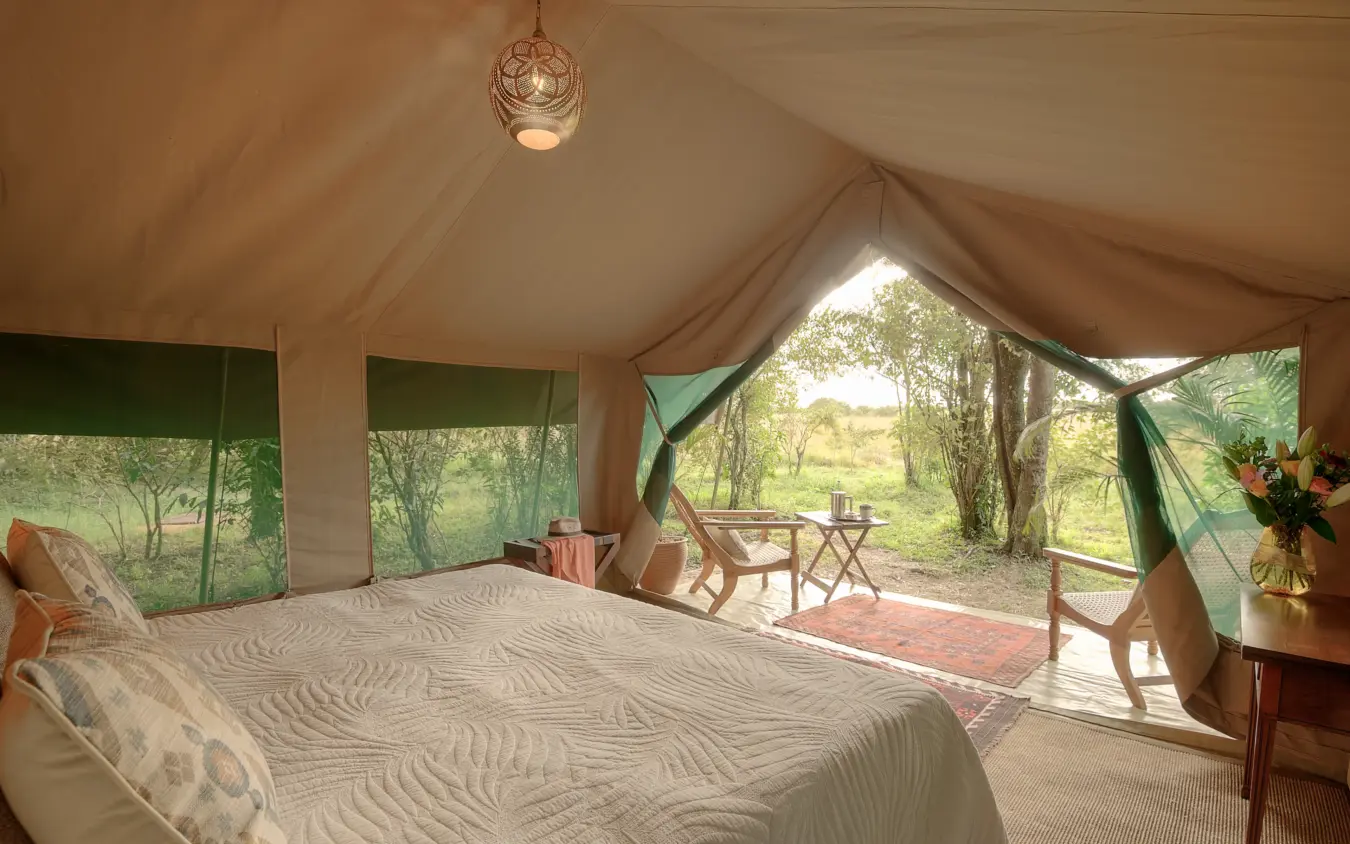 Luxury safari tent bedroom with panoramic views of woodland savanna, Seringet Mara Camp, Maasai Mara, Kenya