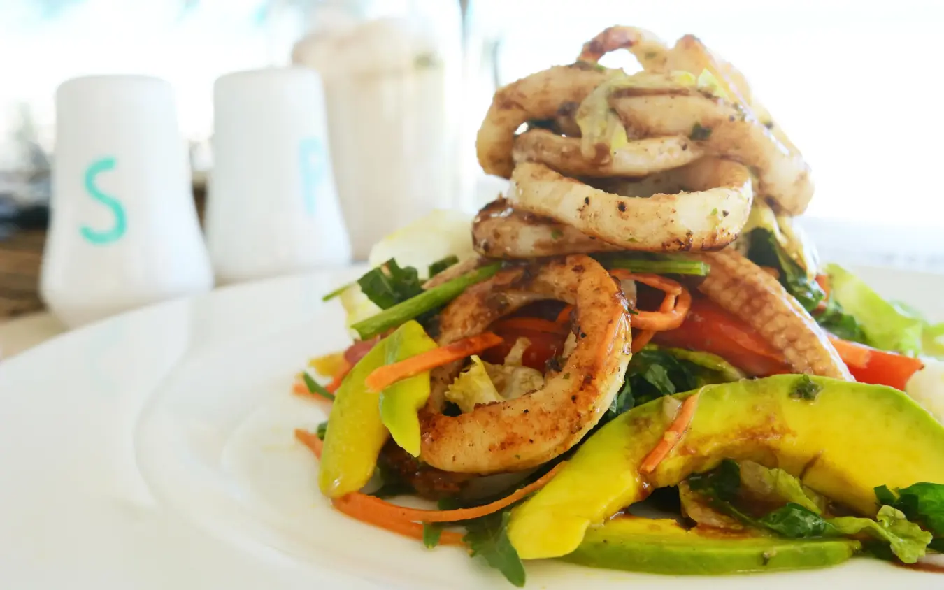 Plated shrimp and vegetable dish with condiments, Sharazad Boutique Hotel, Zanzibar & Pemba, Tanzania