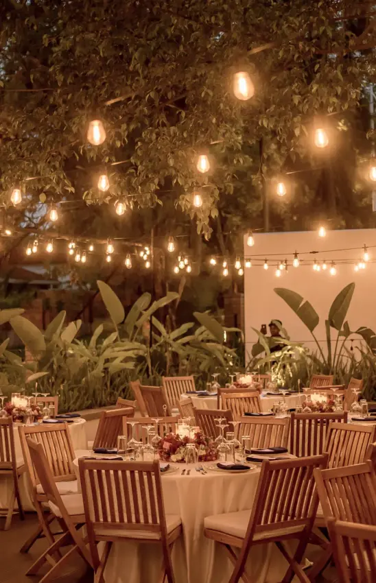 Evening outdoor dining setup with string lights and plants, Hemingways Retreat Kigali, Kigali, Rwanda