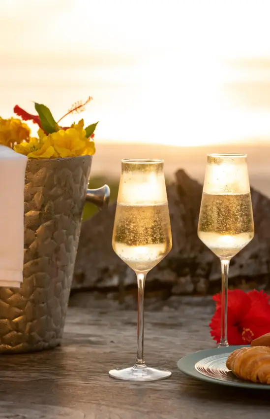 Champagne and pastries on seaside terrace at sunset, White Sand Luxury Villas & Spa, Zanzibar & Pemba, Tanzania